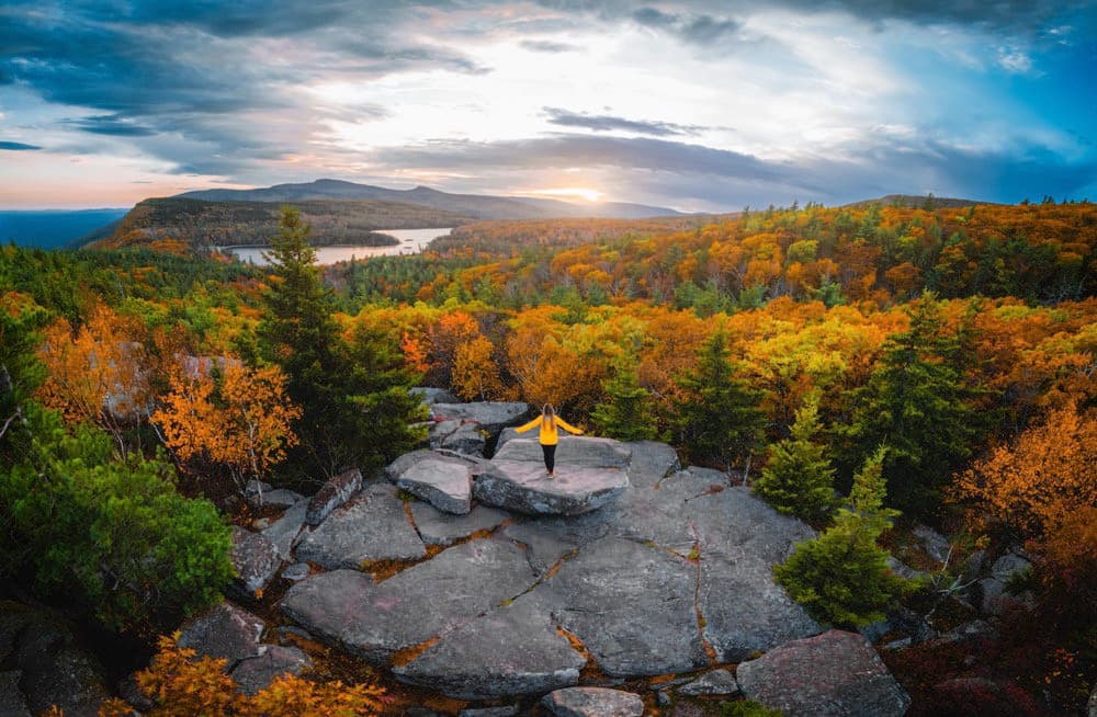 Scenic Catskills mountain vista with hiking trails through lush forest